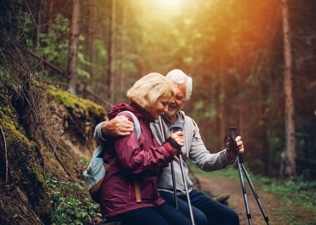 Retired couple hiking in mountains
